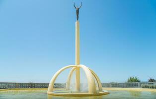 Napier, New Zealand -December-30-2017 - Gilray Fountain Spirit of Napier the 3.6 metre column overlooks the southern portion of Napier's Marine Parade. photo