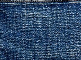 denim texture with seam of jeans photo