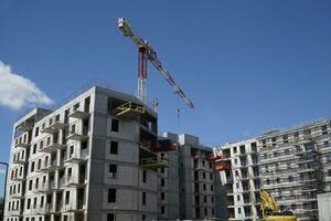 Multi Storey Residential Building and Construction Crane photo