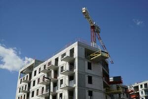 Multi Storey Residential Building and Construction Crane photo
