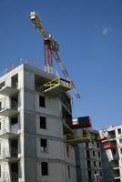 Multi Storey Residential Building and Construction Crane photo