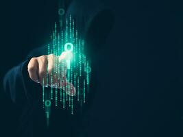 Hacker is pointing his finger at a group of zeros on a dark background. Concept of information security in internet networks and espionage. photo