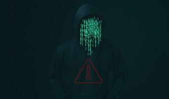 Hacker standing with data protection sign on dark background. Concept of information security in internet networks and espionage. Virus attack. Hacker attack. photo