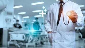 Doctor in lab coat holding a stethoscope on the background inside the hospital photo