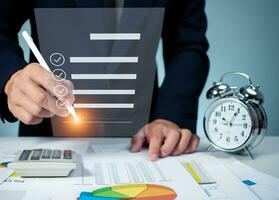 Businessman use electronic pen sign signature on electronic E-signing, data sheet document management, Electronic signature and paperless office concept. photo
