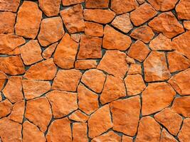 background of red brick wall texture with cracks photo