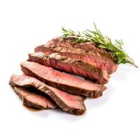 Herb infused sliced beef steak tastefully isolated against a white background photo