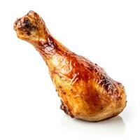 Glistening roasted chicken drumstick meticulously isolated on pure white background photo