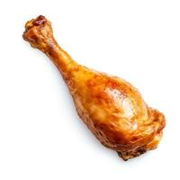 Appetizing roast chicken drumstick cleanly isolated on a stark white background photo