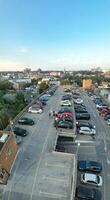 Vertical Aerial Panoramic of British Tourist Attraction at Sea View of Bournemouth City of England Great Britain UK. High Angle Image Captured with Drone's Camera on September 9th, 2023 During Sunset photo