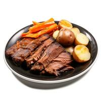 Slow cooked beef brisket with vegetables exquisitely isolated on a white background photo