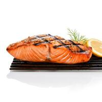 Sizzling salmon steak off the grill brilliantly isolated against white backdrop photo