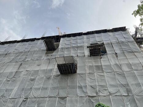 building under construction with scaffolding photo