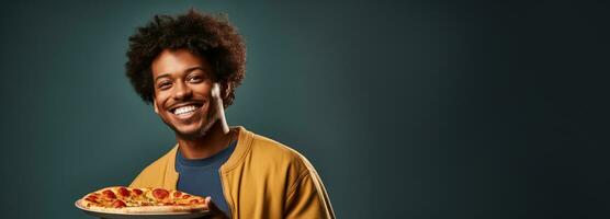 College student enjoying pizza during study break isolated on a cafeteria gradient background photo