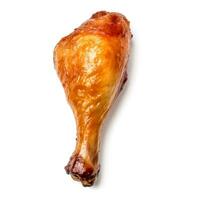 Glistening roasted chicken drumstick meticulously isolated on pure white background photo