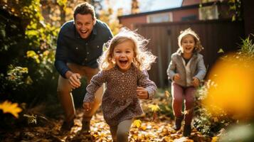 Family playing in leaves in backyard photo