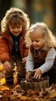 Children playing with fall leaves outside photo