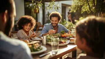 Family gathered around a table, smiling photo