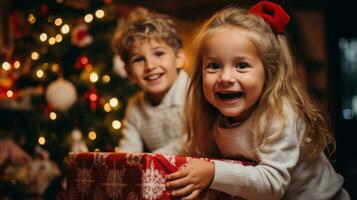 Excited children opening their presents on Christmas morning photo