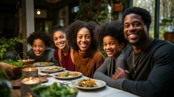 Family gathered around a table, smiling photo