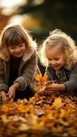 Children playing with fall leaves outside photo