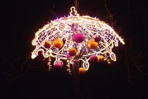 Light colored Christmas decorations at night the streets of Warsaw, Poland photo