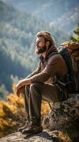 Backpacker taking a break on mountain trail photo