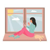 Young woman sitting on the window with a glass of wine and using smartphone. Cute cat sleeping near her. Sunny weather outside the window. vector