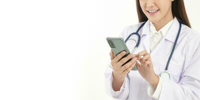 Smartphone concept Connect with online technology communications. A woman doctor holding a smartphone Chat online, treat patients through video calls. White background. Copy space photo