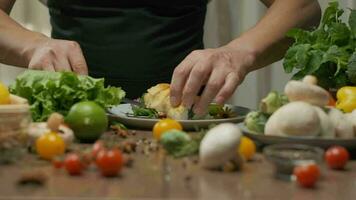 Chef serving chicken roll with spinach on a plate. Slow motion video