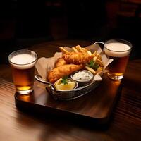 Crispy fish and chips basket with beer photo