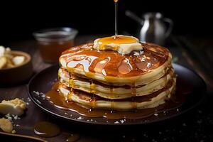 Pancakes with butter honey and maple syrup photo