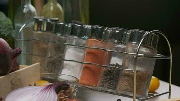 Composition of fresh whole and sliced vegetables on the table. Slow motion video