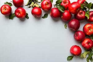 Many red apples on colored background, top view. Autumn pattern with fresh apple above view with copy space for design or text photo