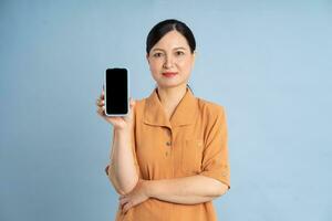 Portrait of an elderly woman using a smartphone photo