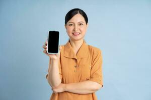 Portrait of an elderly woman using a smartphone photo