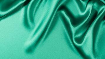 Beautiful light green blue silk satin surface. Soft folds on shiny fabric. Luxury teal background with space for text, design. Ai Generative. photo