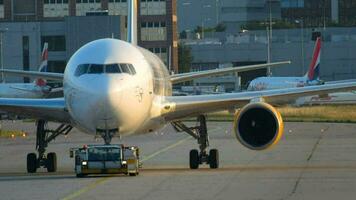 FRANKFURT AM MAIN, GERMANY JULY 21, 2017 - Condor Thomas Cook Boeing 767 D ABUD towing by tractor to service. Fraport, Frankfurt, Germany video