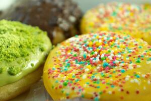 Colorful donuts is placed organizedly, after some edits. photo