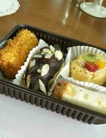 sweet and savory snack dishes on the table ready to eat. consists of four types. photo