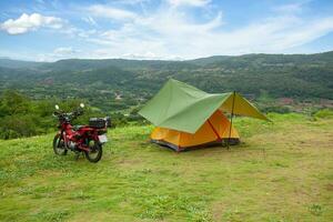 Traveling by motorcycle, camping trip outside the city photo