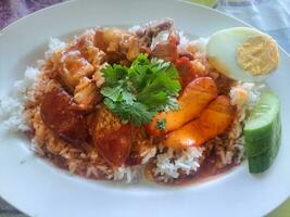 Thai Street Food Barbecued red pork in sauce with rice photo