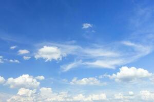 Autumn blue sky background texture with white spindrift very clouds. photo