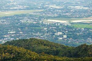 view in the mountains with cityscape over the city of Chiang Mai, Thailand at daytime. photo