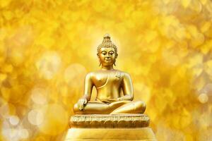 Beautiful of Golden Buddha statue on golden yellow bokeh leaf Pho leaf  background. photo