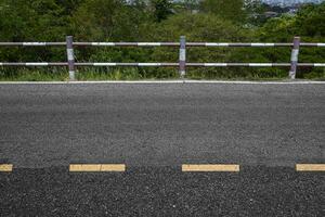 Rural road with stiles marking lines white stripes texture Background. photo