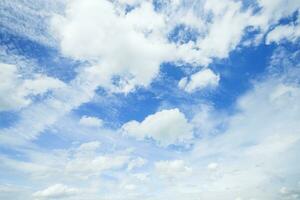 Autumn blue sky background texture with white spindrift very clouds. photo