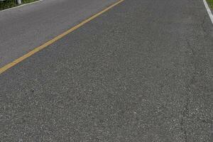 Asphalt road with marking lines white stripes texture Background. photo