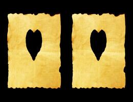 old paper sheet with heart symbol on black background photo