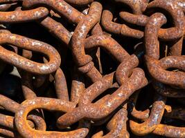 rusty metal chains in the port. close up photo